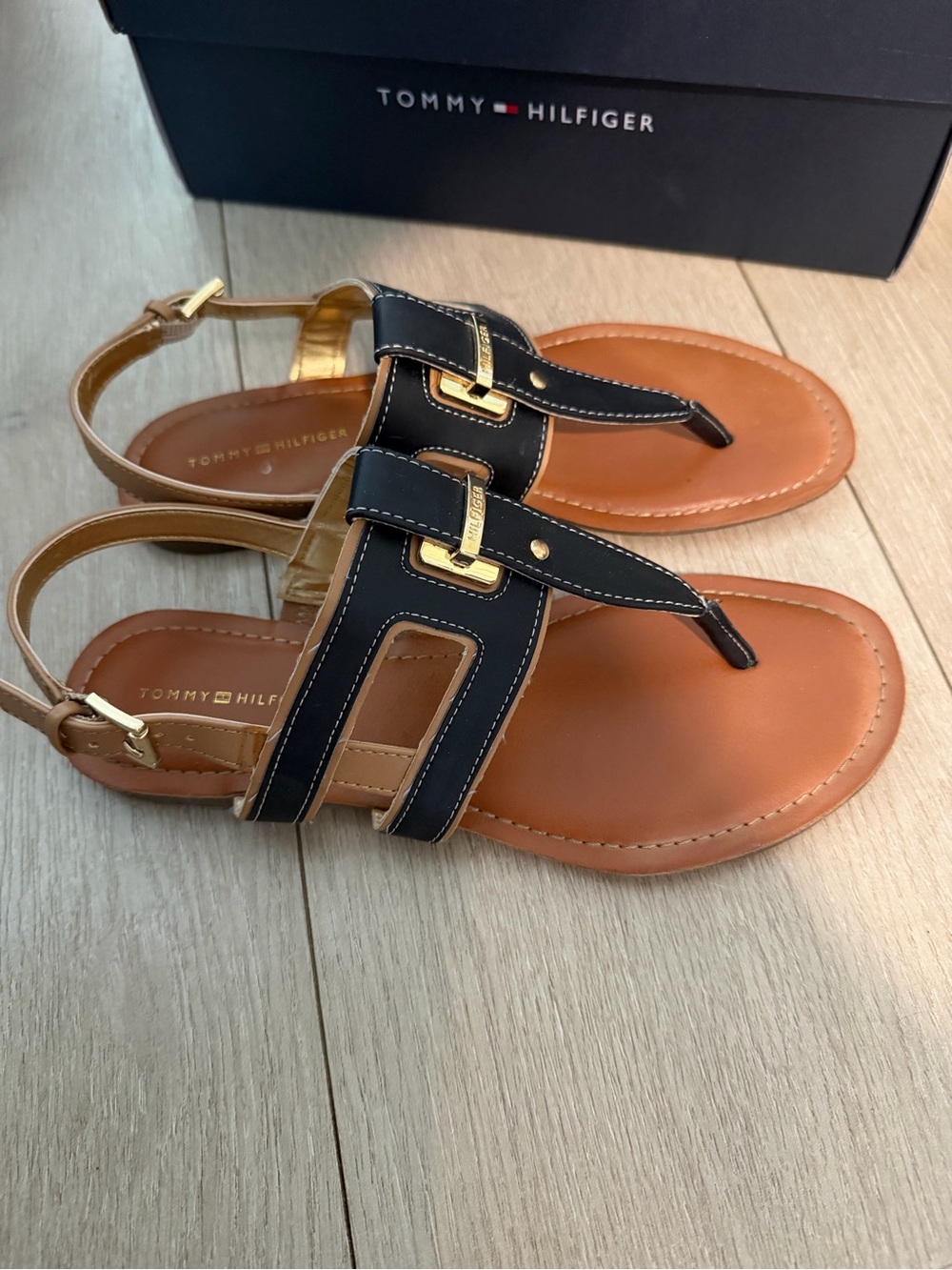 Tommy Hilfiger Black and Tan Leather T-Strap Sandals with Gold Accents
